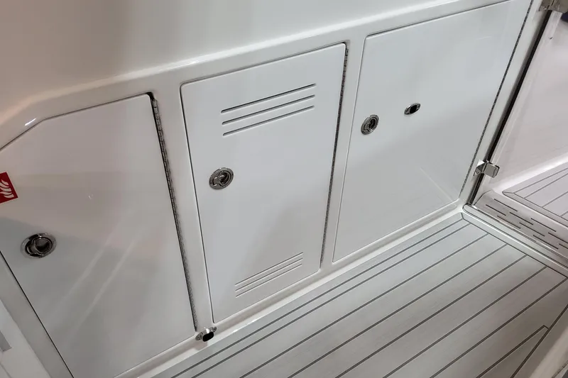 Slide: The Image of 2026 Formula 400 Super Sport Crossover boat interior with sleek storage compartments. - 56