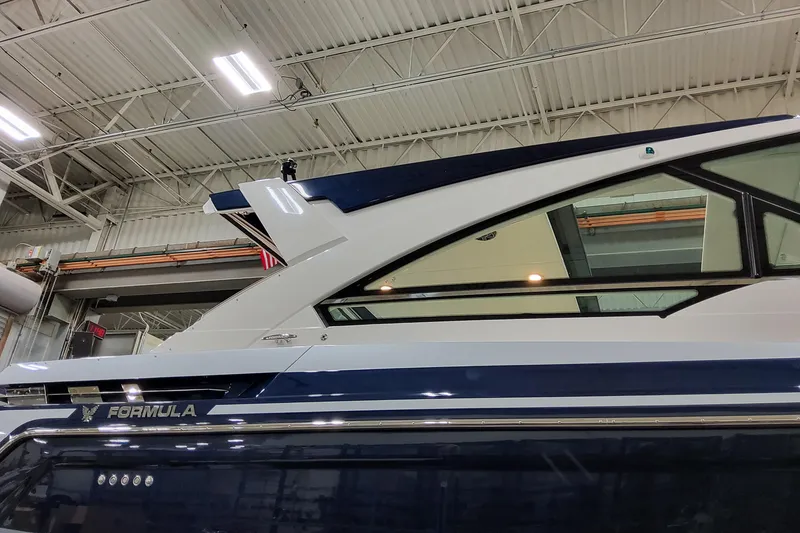 Slide: The Image of 2026 Formula 400 Super Sport Crossover yacht in a warehouse setting. - 6