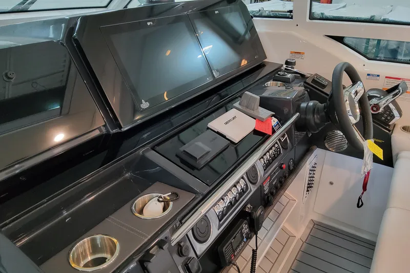 Slide: The Image of 2026 Formula 400 Super Sport Crossover helm with advanced navigation displays and controls. - 60