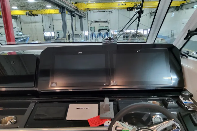 Slide: The Image of Control panel of 2026 Formula 400 Super Sport Crossover with dual screens and steering wheel. - 62