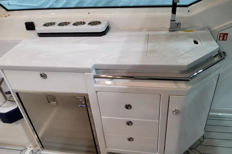 Slide: The Image of 2026 Formula 400 Super Sport Crossover yacht interior with sleek kitchenette and modern fixtures. - 67