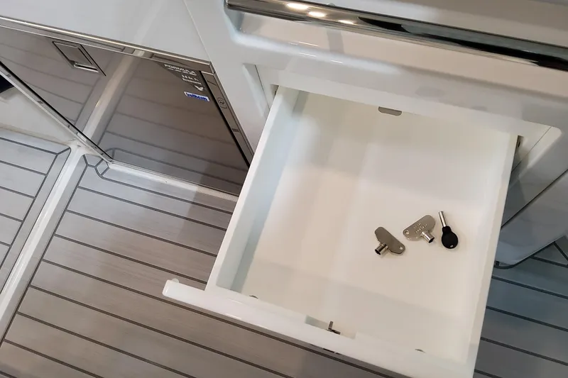 Slide: The Image of Open drawer with keys inside on 2026 Formula 400 Super Sport Crossover boat. - 70