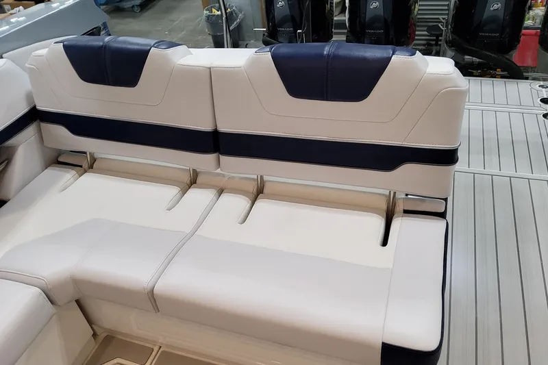 Slide: The Image of 2026 Formula 400 Super Sport Crossover boat seating with blue and white upholstery. - 76