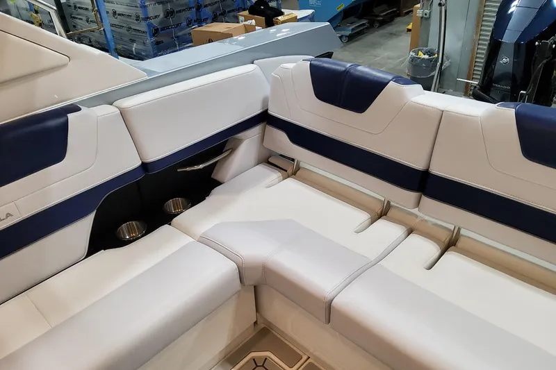 Slide: The Image of 2026 Formula 400 Super Sport Crossover interior seating with blue and white upholstery. - 77