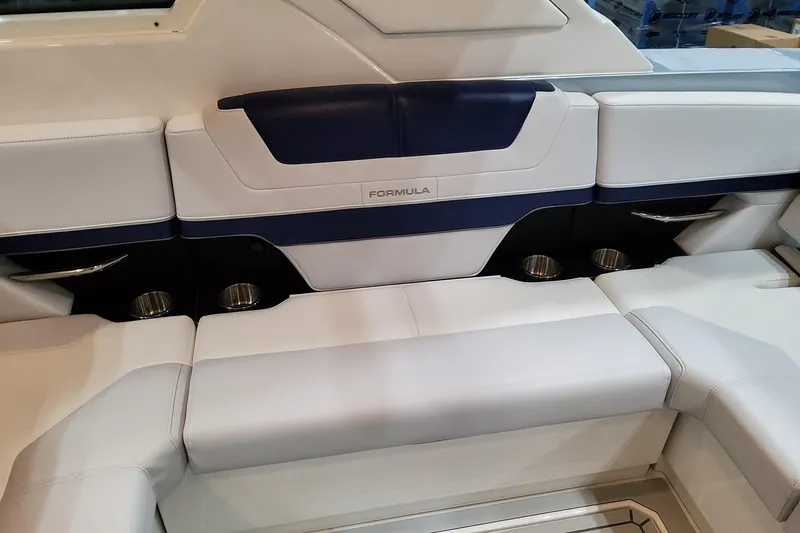 Slide: The Image of 2026 Formula 400 Super Sport Crossover boat interior with luxurious seating and cup holders. - 78