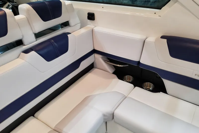 Slide: The Image of 2026 Formula 400 Super Sport Crossover interior with white and blue seating, cup holders. - 79