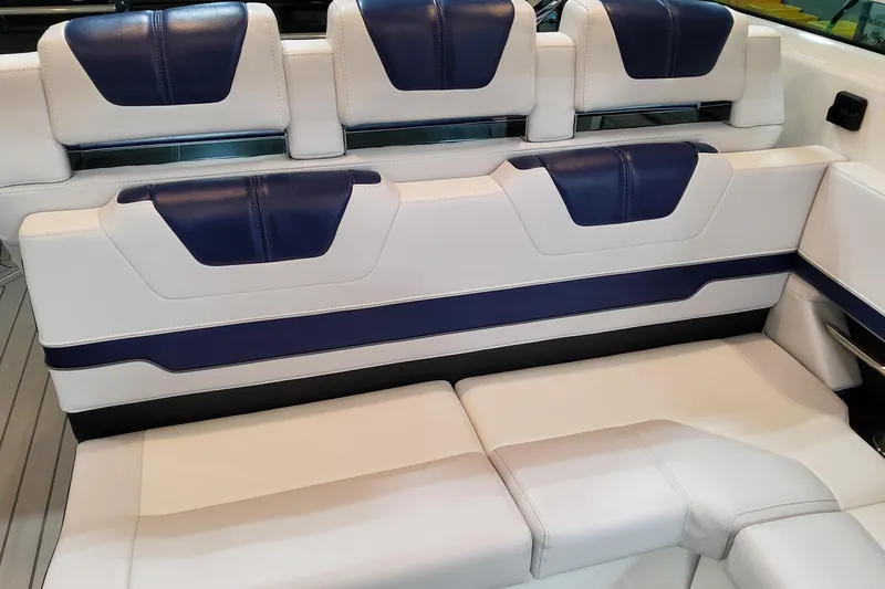 Slide: The Image of 2026 Formula 400 Super Sport Crossover boat seating with blue and white upholstery. - 80