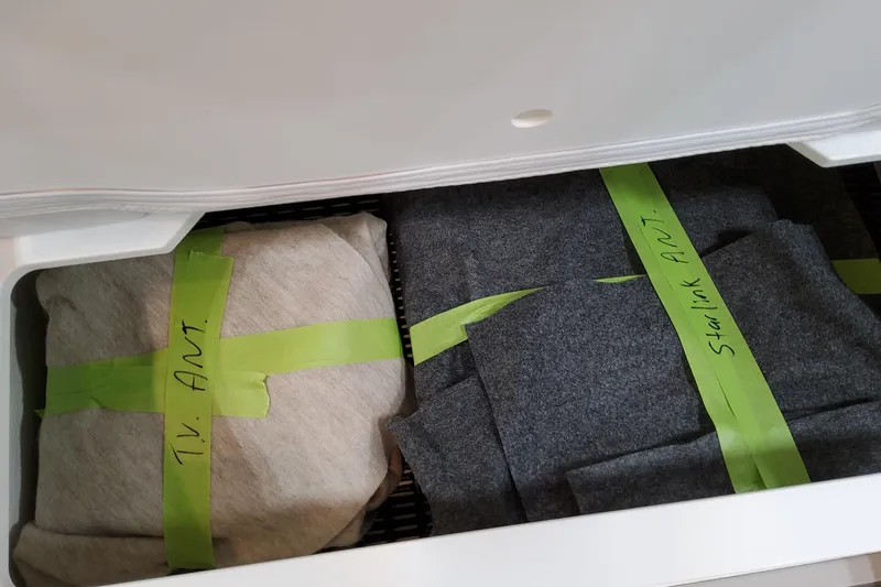 Slide: The Image of Drawer with labeled TV and Starlink antennas, Formula 400 Super Sport Crossover 2026. - 85