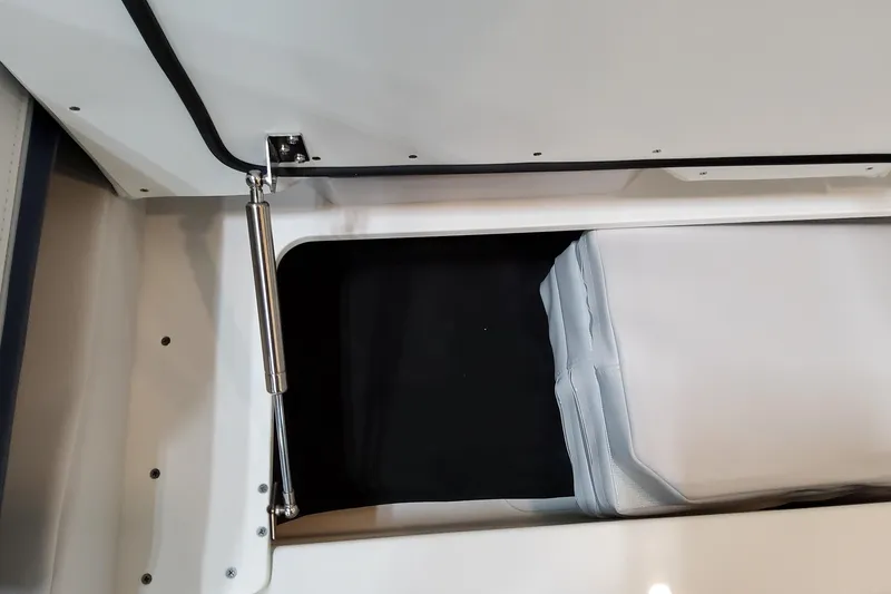 Slide: The Image of 2026 Formula 400 Super Sport Crossover storage compartment with hydraulic lift and cushioned interior. - 87