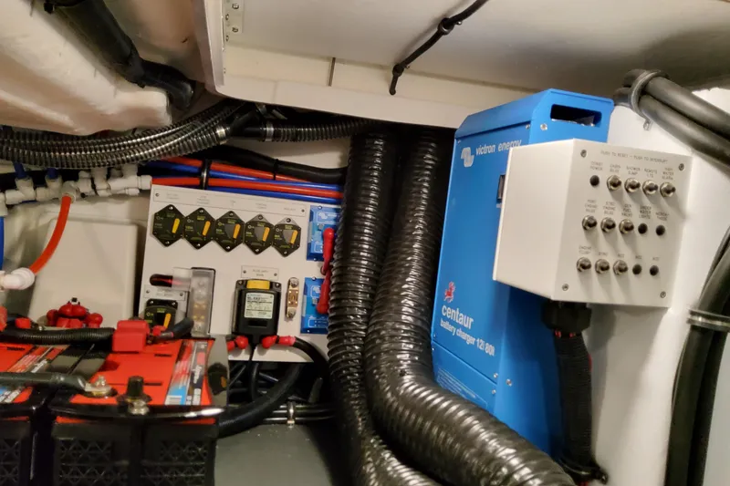 Slide: The Image of Electrical system of 2026 Formula 400 Super Sport Crossover with battery charger and control panel. - 99