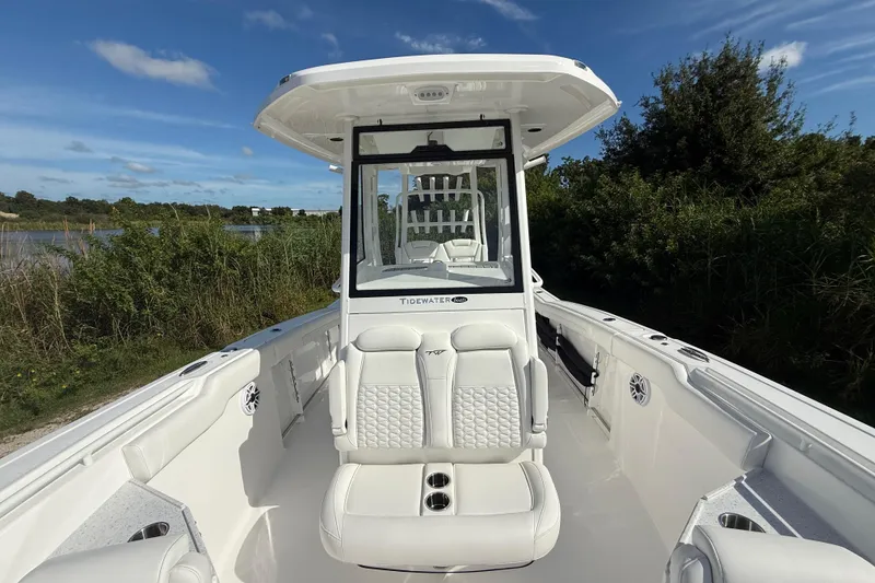 Slide: The Image of 2026 Tidewater 282 CC Adventure boat with sleek white interior and modern design. - 27