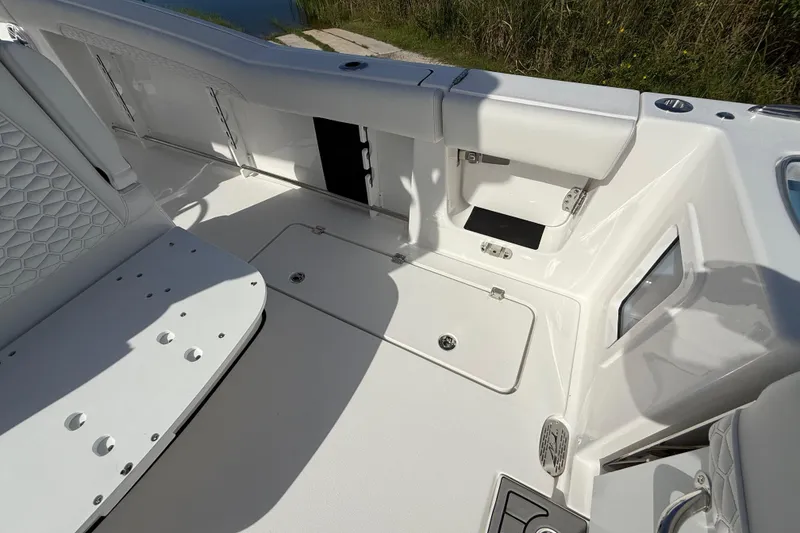 Slide: The Image of 2026 Tidewater 282 CC Adventure boat interior with seating and storage compartments. - 41