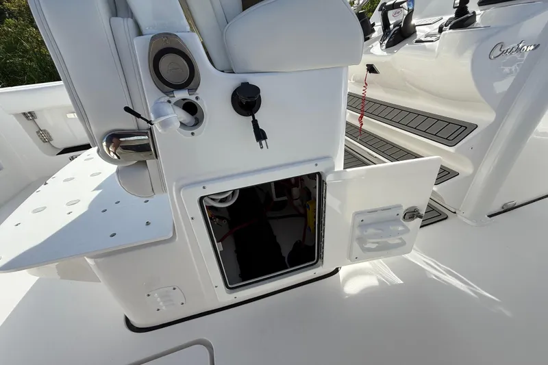 Slide: The Image of Open storage compartment on 2026 Tidewater 282 CC Adventure boat interior. - 44