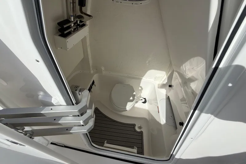 Slide: The Image of 2026 Tidewater 282 CC Adventure boat interior bathroom with toilet and modern fixtures. - 50