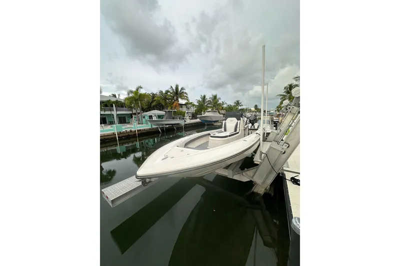 The Image of 2021 ShearWater 270 Carolina Flare boat docked in a tropical marina setting. - 0