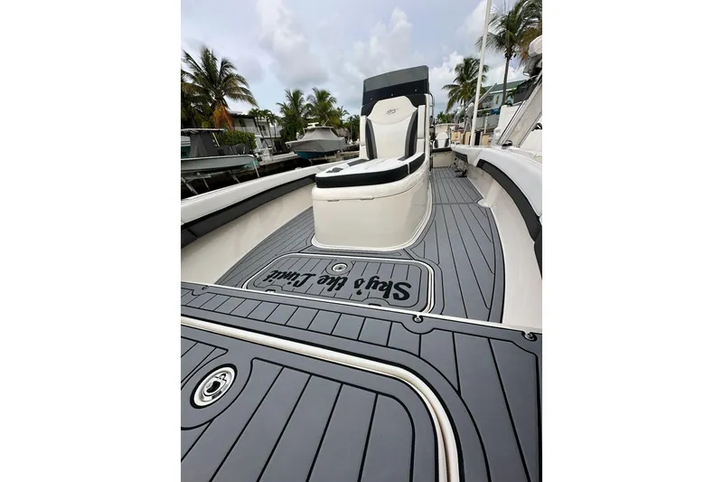 Slide: The Image of 2021 ShearWater 270 Carolina Flare boat with sleek deck design and comfortable seating. - 11