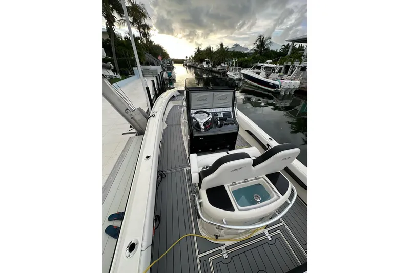 Slide: The Image of 2021 ShearWater 270 Carolina Flare boat docked, featuring sleek design and modern controls. - 12