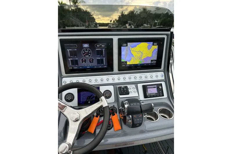 Slide: The Image of 2021 ShearWater 270 Carolina Flare boat dashboard with navigation and control systems. - 14
