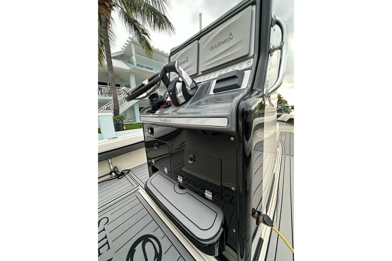 Slide: The Image of 2021 ShearWater 270 Carolina Flare boat console with Garmin electronics and sleek design. - 17