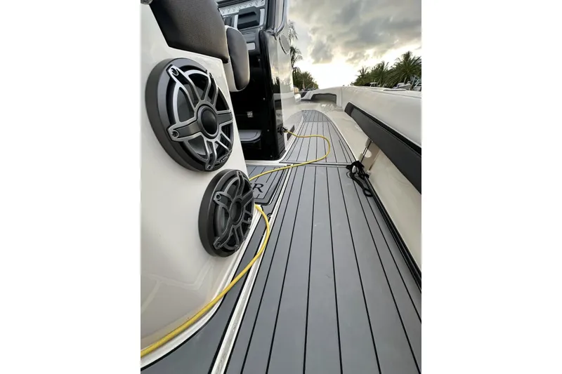 Slide: The Image of 2021 ShearWater 270 Carolina Flare boat deck with speakers and sleek design. - 18
