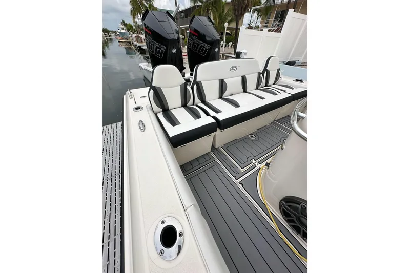 Slide: The Image of 2021 ShearWater 270 Carolina Flare boat interior with dual engines and sleek seating. - 20