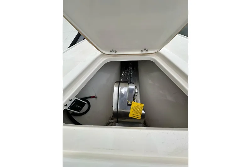 Slide: The Image of 2021 ShearWater 270 Carolina Flare boat anchor compartment with open hatch. - 27