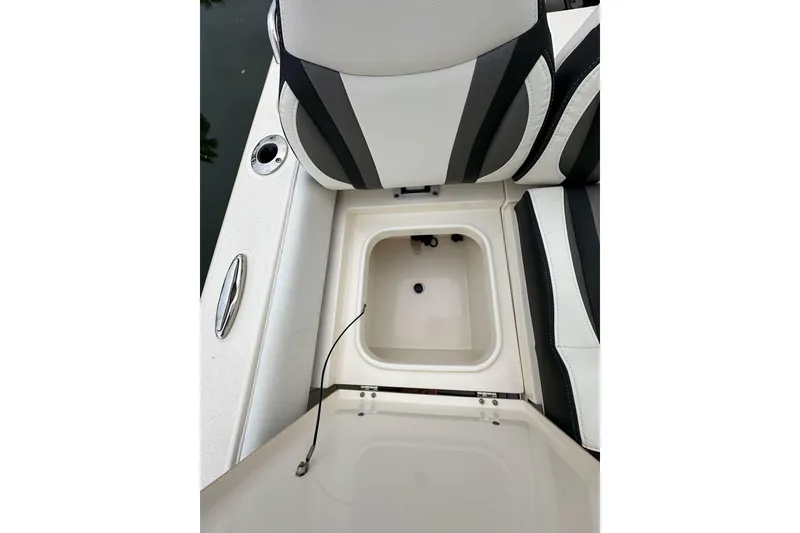 Slide: The Image of 2021 ShearWater 270 Carolina Flare boat seat with storage compartment open. - 31