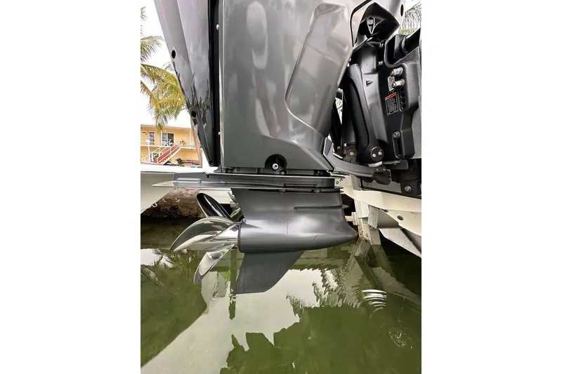 Slide: The Image of Close-up of 2021 ShearWater 270 Carolina Flare boat engine and propeller in water. - 34