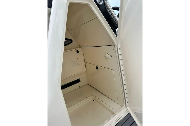 Slide: The Image of Interior cabin of 2021 ShearWater 270 Carolina Flare boat, featuring storage compartments. - 36