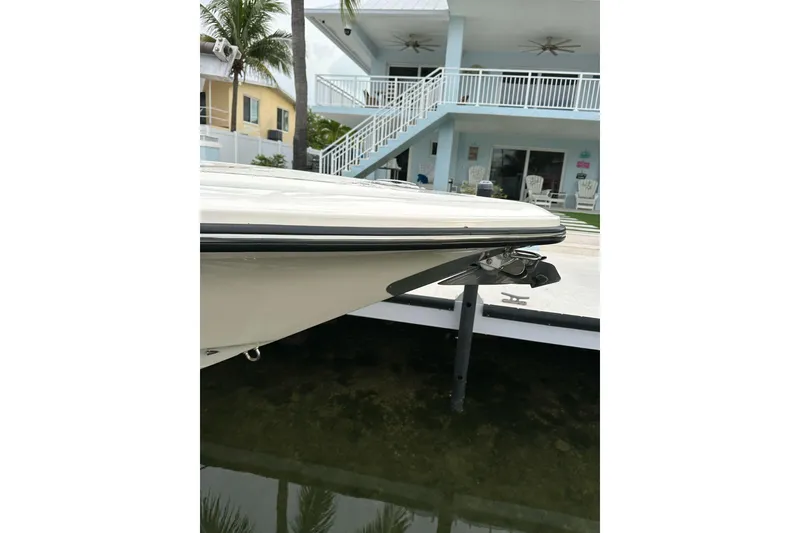 Slide: The Image of 2021 ShearWater 270 Carolina Flare boat docked near waterfront home. - 38