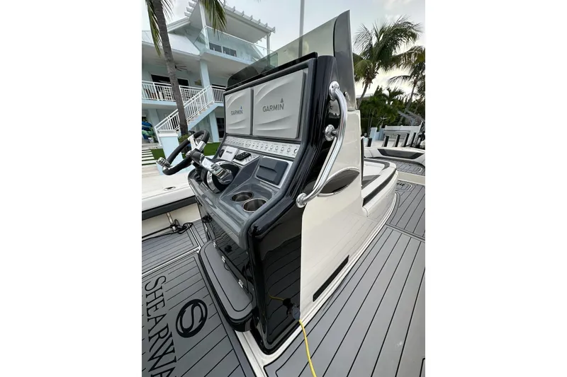 Slide: The Image of 2021 ShearWater 270 Carolina Flare boat console with Garmin displays and sleek design. - 41