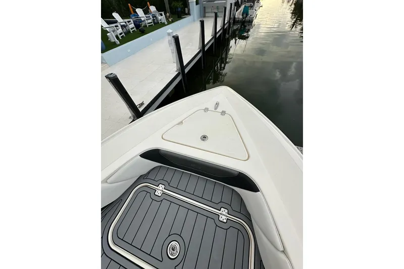 Slide: The Image of Bow view of 2021 ShearWater 270 Carolina Flare boat docked by a pier. - 45