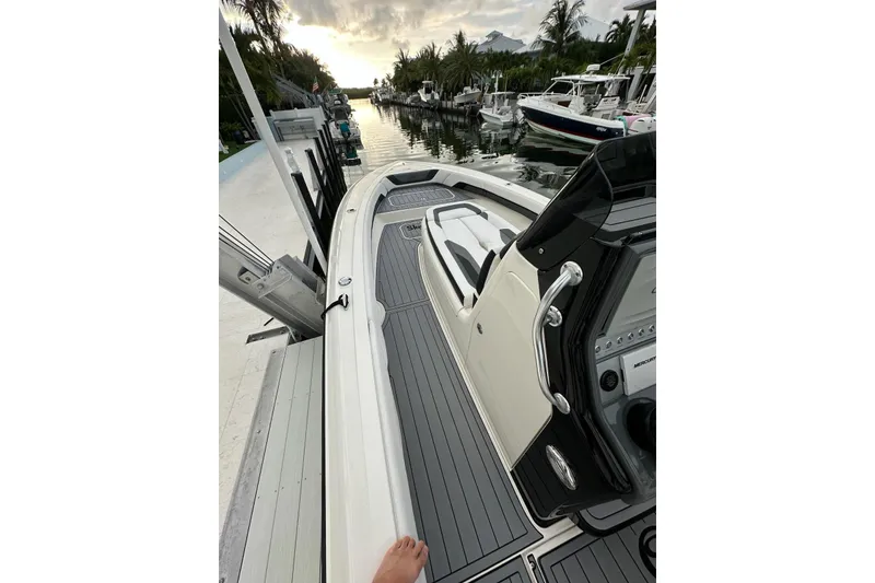 Slide: The Image of 2021 ShearWater 270 Carolina Flare boat docked at a scenic marina. - 6