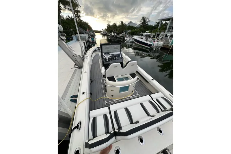 Slide: The Image of 2021 ShearWater 270 Carolina Flare boat docked, featuring sleek design and modern controls. - 8