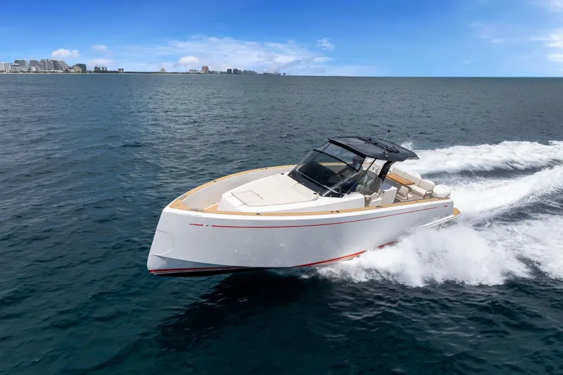Slide: The Image of 2021 Pardo Yachts 38 cruising on open water under a clear blue sky. - 0