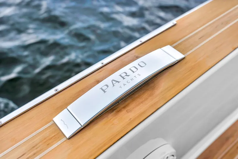 Slide: The Image of Pardo Yachts 38, 2021 model, elegant wooden deck detail with ocean backdrop. - 13