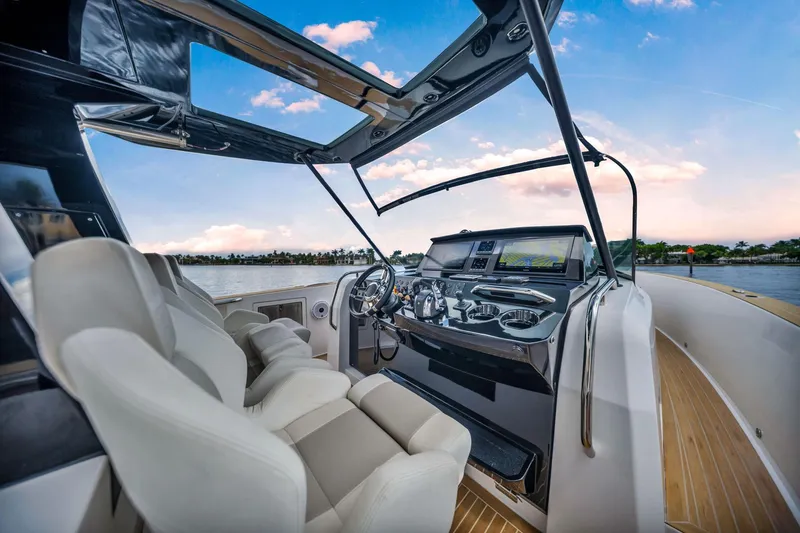 Slide: The Image of Luxurious 2021 Pardo Yachts 38 cockpit with modern controls and plush seating. - 22