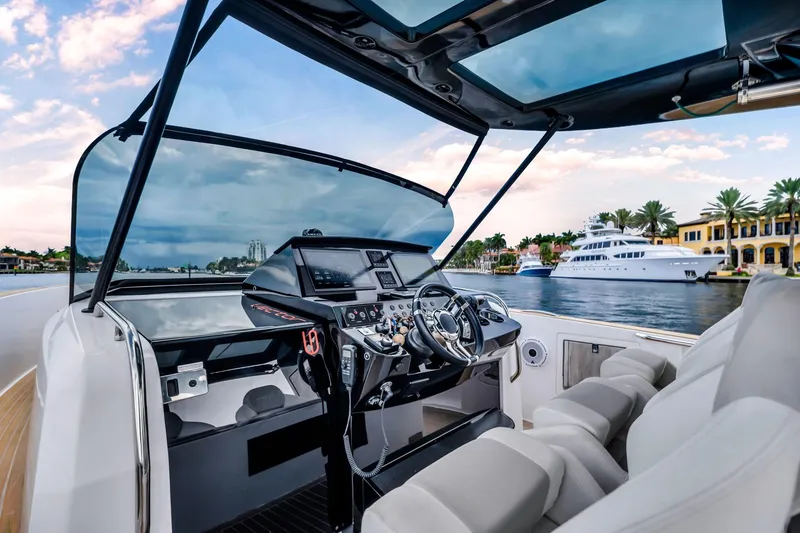 Slide: The Image of Cockpit view of 2021 Pardo Yachts 38, luxury yacht on scenic waterfront. - 26