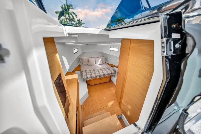 Slide: The Image of Interior cabin of 2021 Pardo Yachts 38, featuring a cozy bed and wooden finishes. - 28