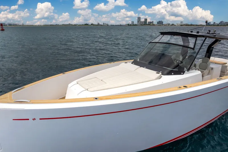 Slide: The Image of 2021 Pardo Yachts 38 on water, sleek design, city skyline in background. - 3