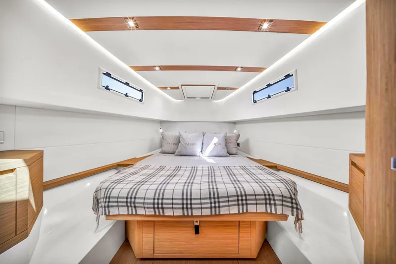 Slide: The Image of Luxurious cabin interior of 2021 Pardo Yachts 38, featuring elegant wood accents and cozy bedding. - 31