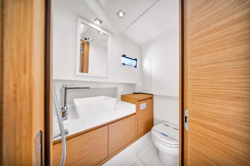 Slide: The Image of Modern bathroom interior on 2021 Pardo Yachts 38, featuring sleek wood finishes and contemporary fixtures. - 36
