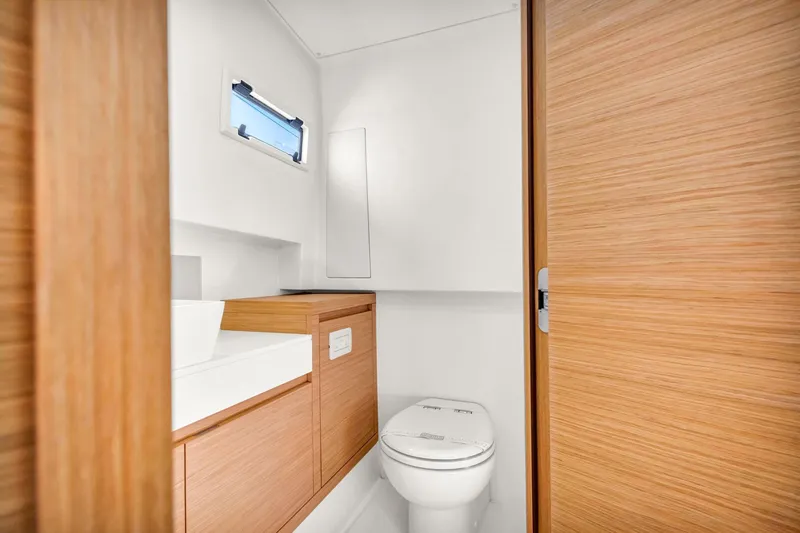 Slide: The Image of Modern bathroom interior on 2021 Pardo Yachts 38, featuring sleek wood finishes and compact design. - 37