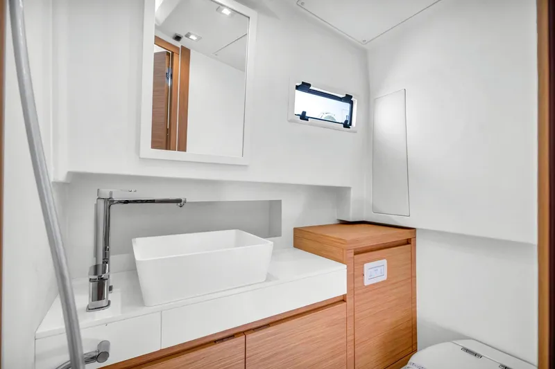 Slide: The Image of Modern bathroom interior of 2021 Pardo Yachts 38, featuring sleek sink and wooden cabinetry. - 38