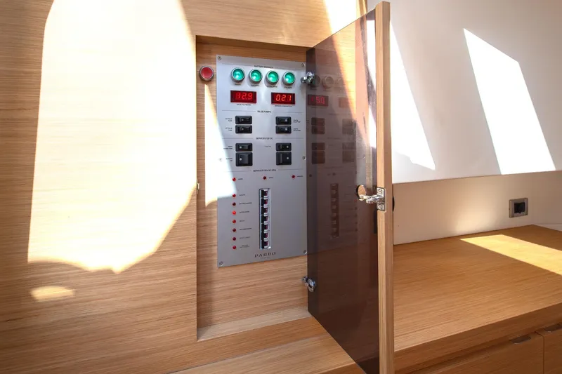 Slide: The Image of Control panel inside 2021 Pardo Yachts 38, featuring switches and digital displays. - 40
