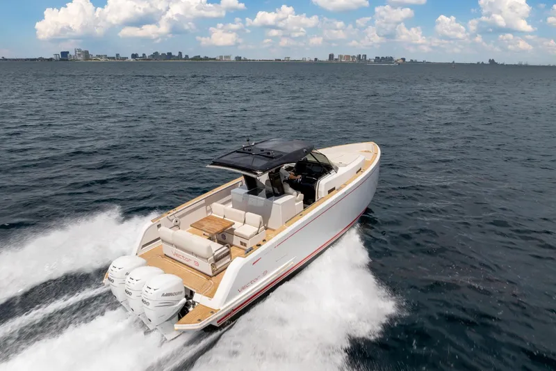 Slide: The Image of 2021 Pardo Yachts 38 cruising on open water under a clear sky. - 51