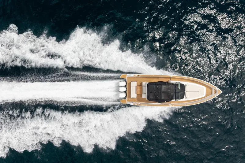 Slide: The Image of Overhead view of 2021 Pardo Yachts 38 speeding on open water. - 54