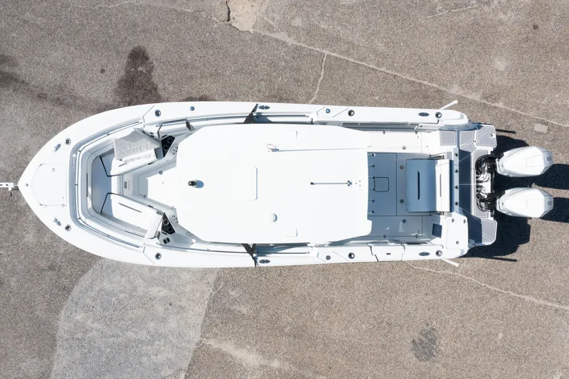 Slide: The Image of Aerial view of 2023 Blackfin 302 CC boat on concrete surface. - 12