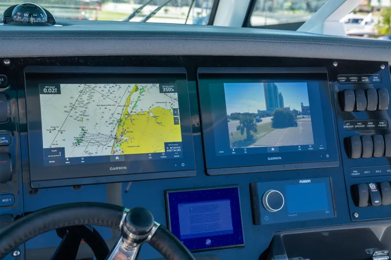 Slide: The Image of Dashboard of 2023 Blackfin 302 CC with Garmin navigation displays. - 17