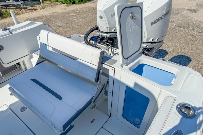 Slide: The Image of 2023 Blackfin 302 CC boat interior with seating and storage compartments. - 26